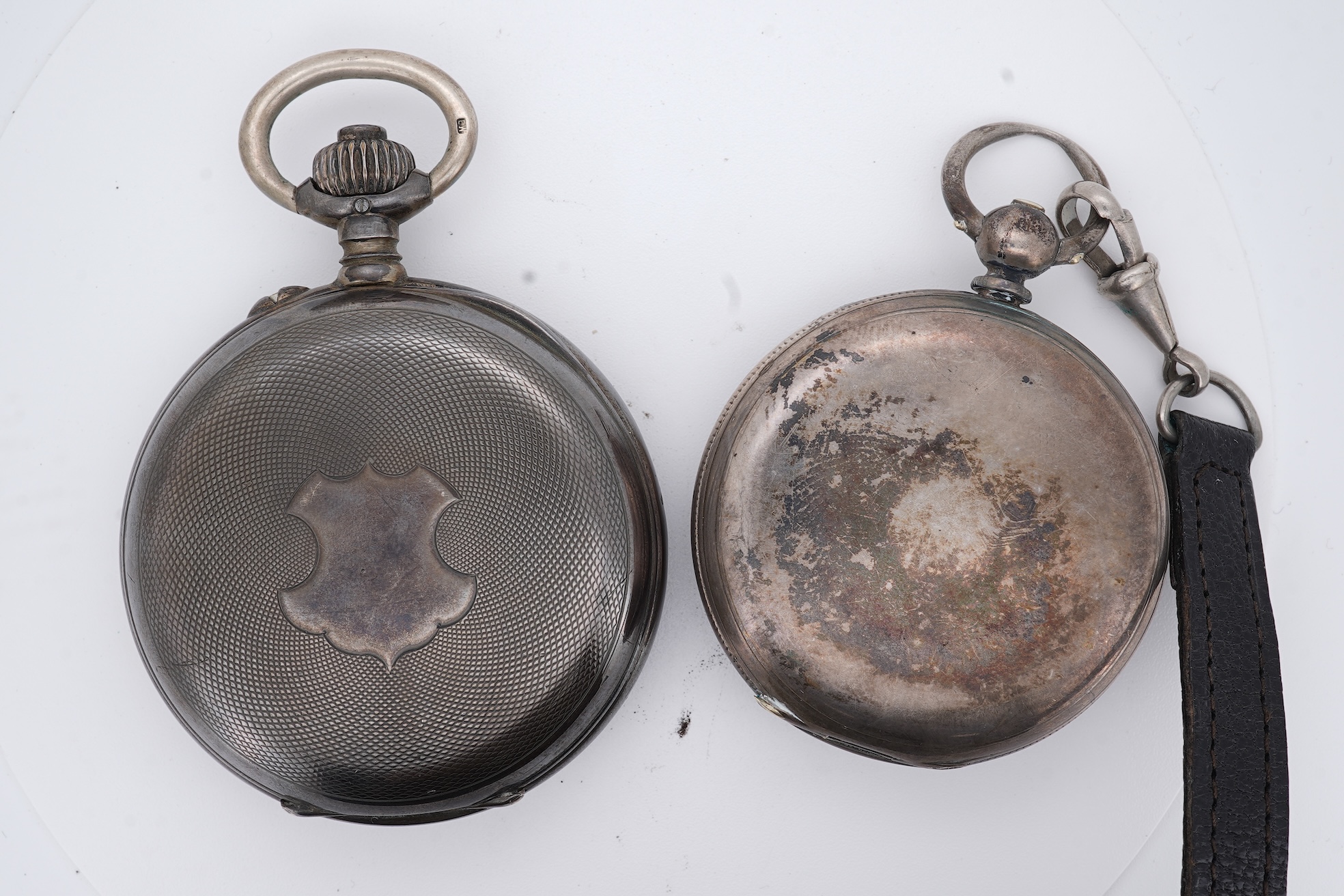 An early 20th century continental 800 standard white metal open faced chronograph pocket watch, with Roman numerals and two subsidiary dials, case diameter 50mm, together with a similar smaller white metal open faced poc